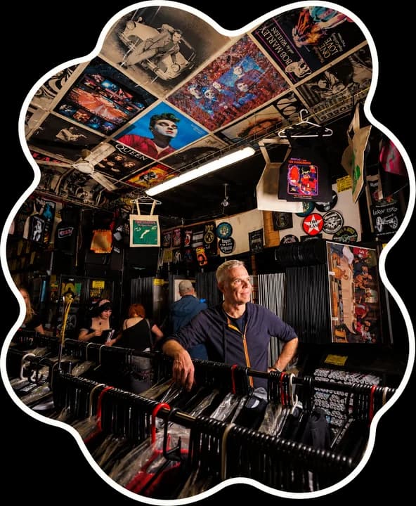 Inside a vintage clothing shop at Afflecks, with posters across the ceiling